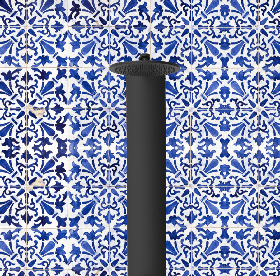 RainStick Recirculating Shower in Matte Black in front of Blue Tile Mosaic Wall